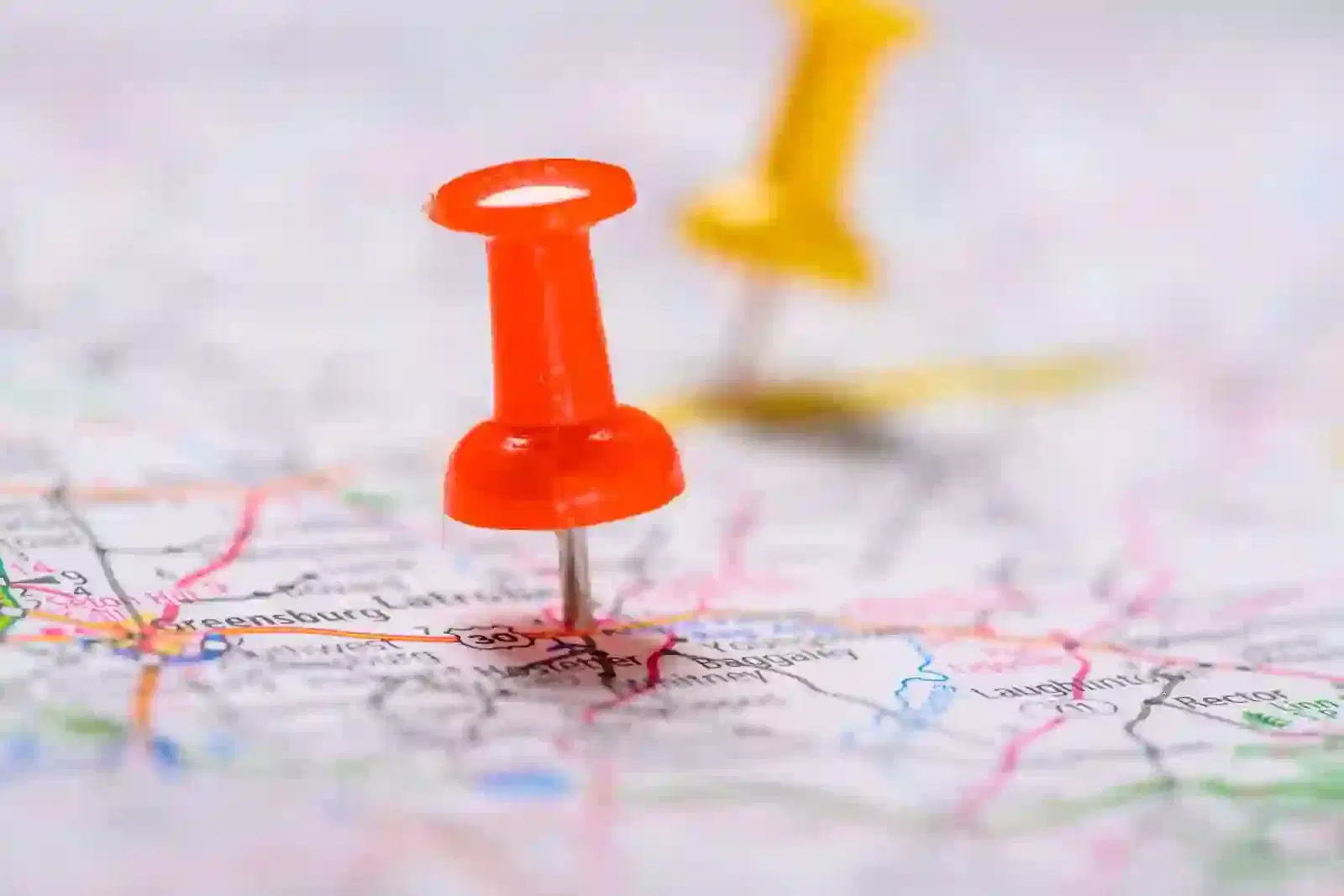 Red and yellow Pushpins on a map