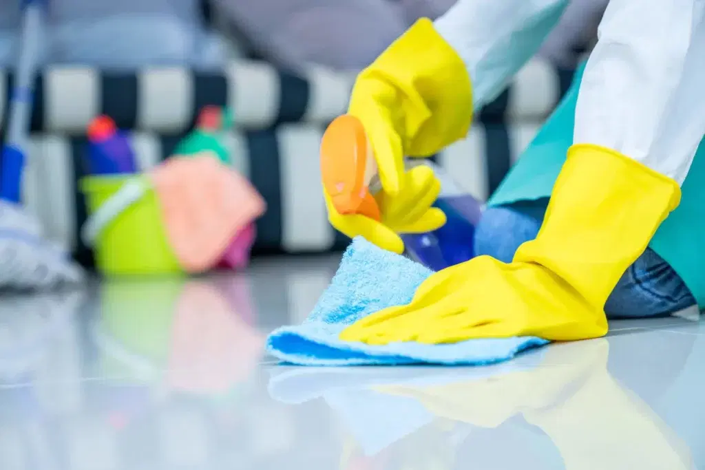 housekeeper washing floor