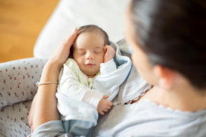 mother holding newborn baby